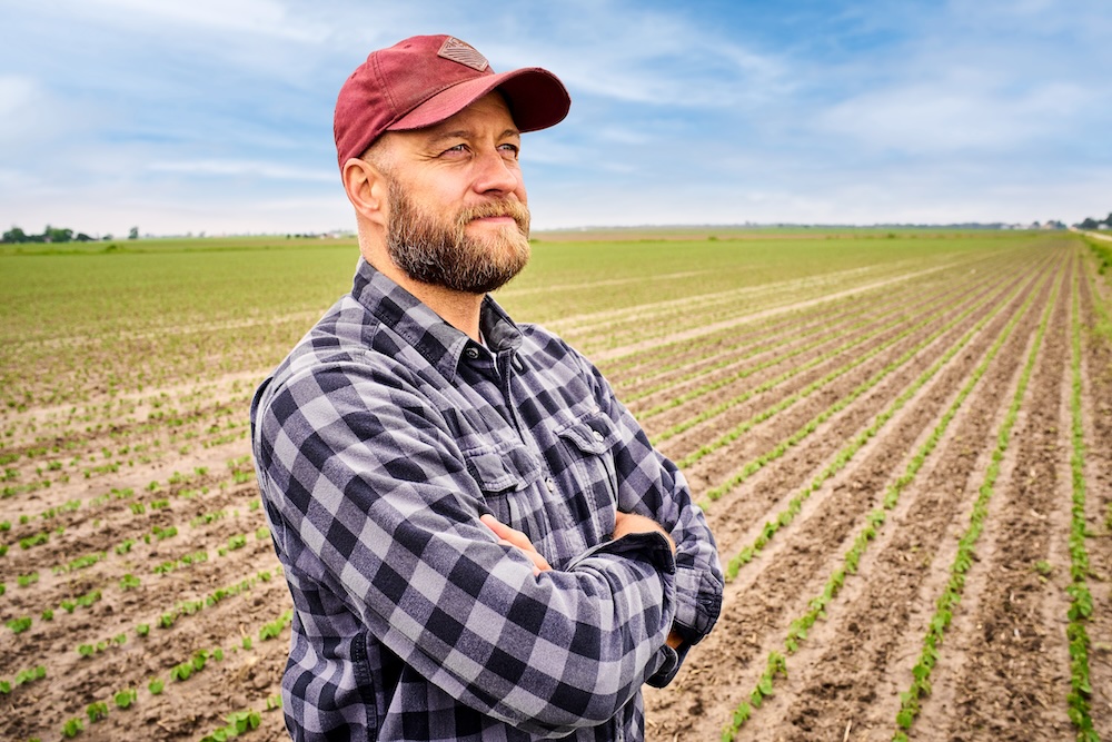 Farmer standing in field