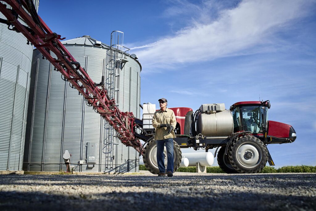 Farmer with sprayer equipment.