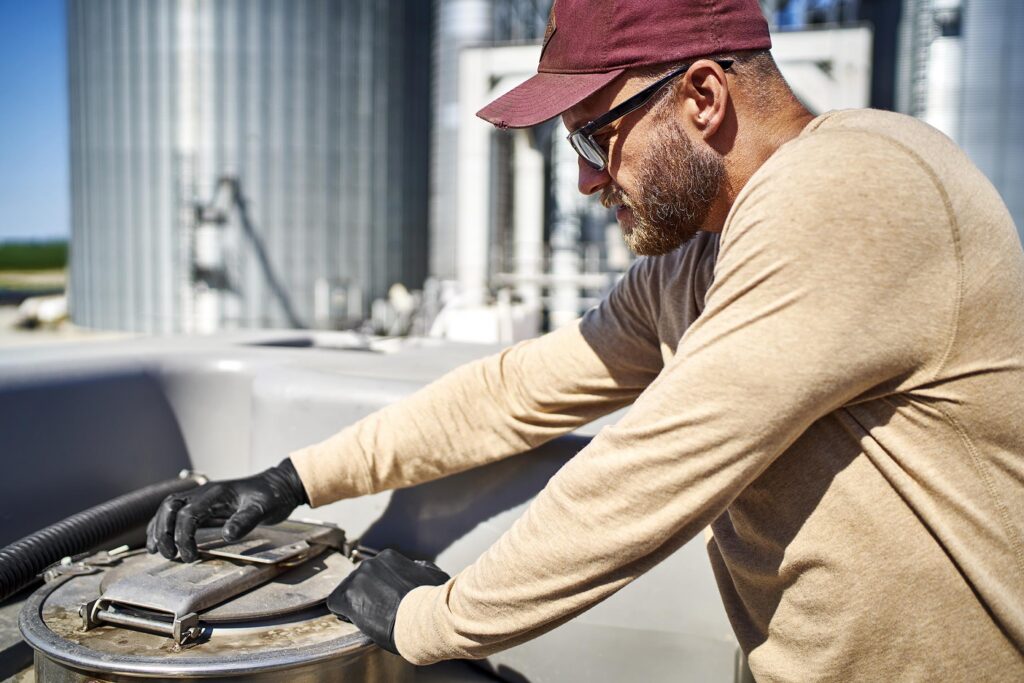 Farmer with spray equipment.